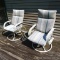 Rocking swiveling deck or porch chairs, plus a glass topped side table.