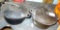 Two 4.5 quart cast iron Dutch ovens with lids, measure about 10