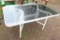 Glass-topped patio table is about 37