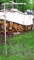 Galvanized water pipe 5' tall that hold up a campfire grate.