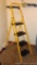 Folding step ladder looks to be near new. Stands 64