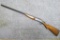 Scout top break shotgun. Action locks up tight. Butt stock is loose on rear tang, has an old crack