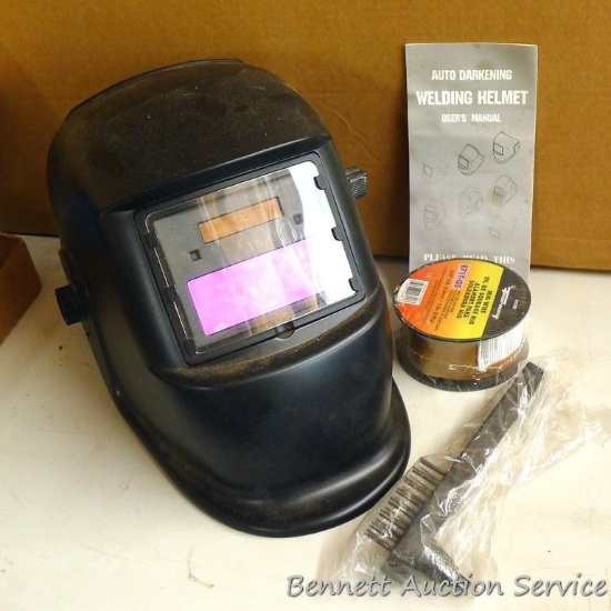 Deko auto darkening welding helmet with 1-1/2" x 3-1/2" window; 2 lb. roll of MIG wire .030" dia.