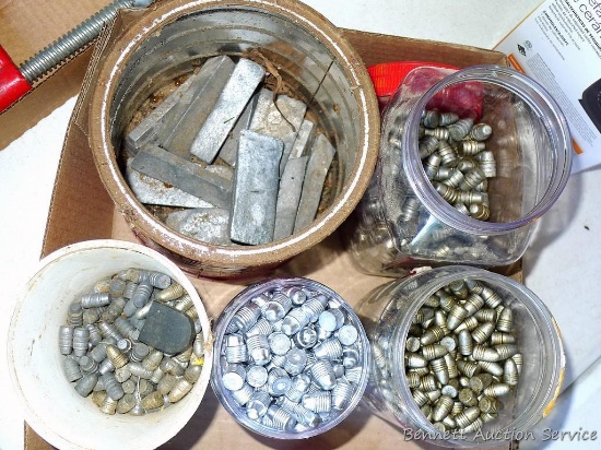 Containers of lead bullets for reloading, most are 9/16" long; container of lead bricks up to 3" x