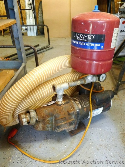 Wayne 1 HP shallow well jet pump is 18" long. Has a pressure gauge, 1-3/4" outlet, 10' flexible hose