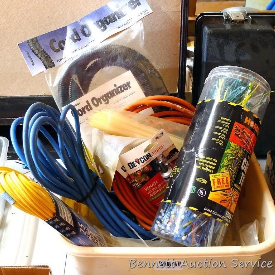 Three extension cords; 8 ft. flexible cord organizer; 2 new pkgs. Weld It all purpose adhesive; lots