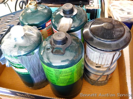 Coleman single mantle propane lantern is 7" x 4"; four 16 oz. canisters propane, some are unopened.