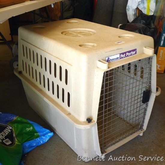 Petmate Pet Porter is 22" x 32" x 23" tall.
