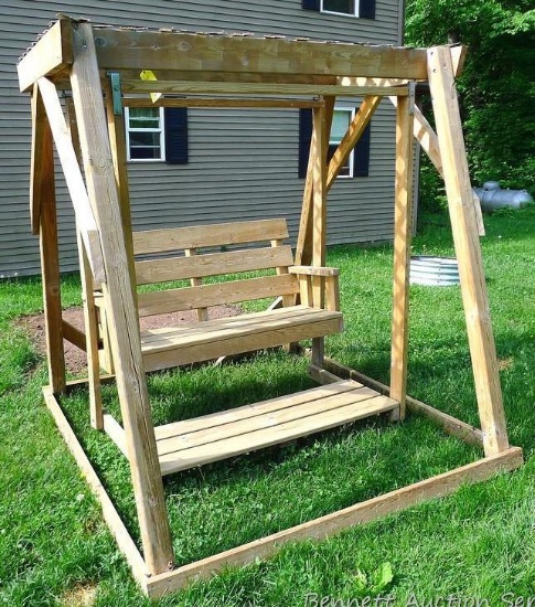 Nice wooden gliding swing, seat is about 54" wide. Swings smoothly, very comfortable.
