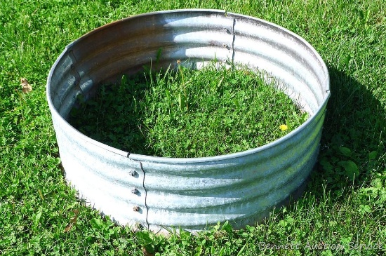 Galvanized steel fire ring is 3' x 1'.