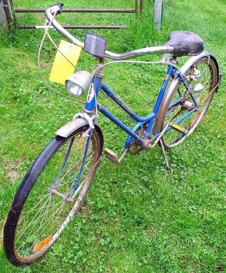 Vintage Schwinn Breeze bike is about 6' x 40". Rust noted but it still has a headlight and rear