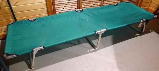 6'-3" aluminum framed camp cot is in good condition with a little sway and some material frays.