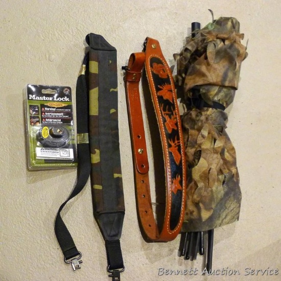 Advantage Timber camo blind section; leather and synthetic rifle slings; Masterlock brand gun lock.