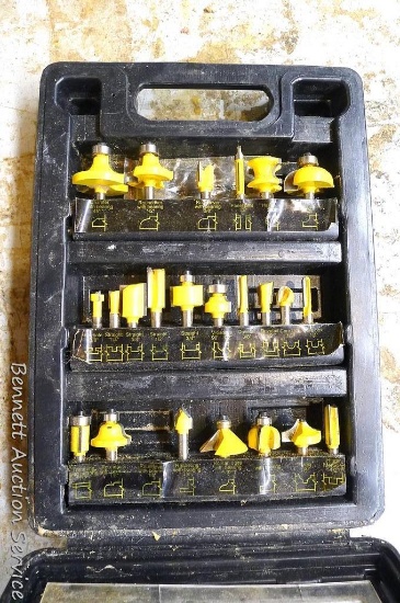Almost a complete set of router bits, some have bearings. Largest is 1". Box is 8-1/2" x 11-1/2" x