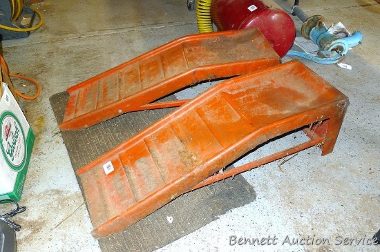Two metal car ramps are about 35" x 10" x 10".