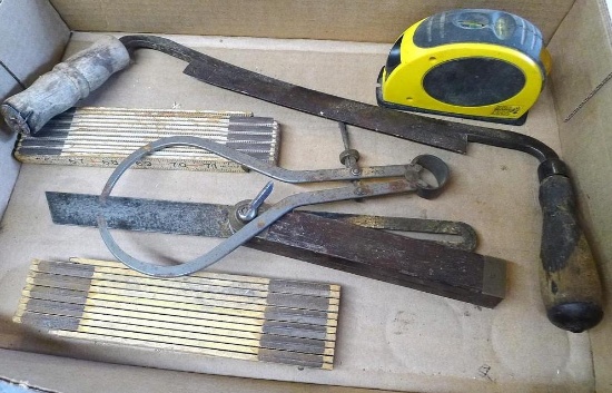 Strait -Line laser level, draw shave, folding measuring sticks, more. Draw shave is about 16" x 6".