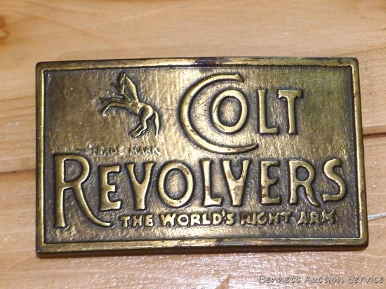 Brass toned Colt Revolver belt buckle measures approx. 2-1/4" x 3-3/4".