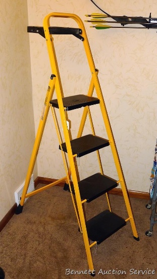 Folding step ladder looks to be near new. Stands 64" to top of handle open, 42" to top step open.