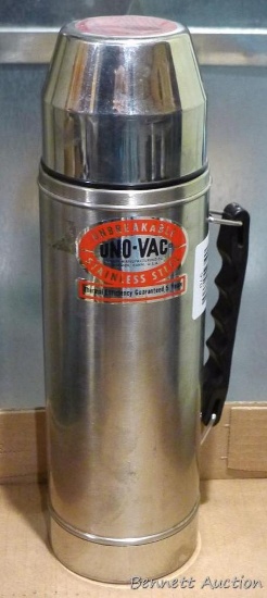 Unbreakable Uno-Vac stainless steel thermos is about 13" tall and includes stopper and lid.