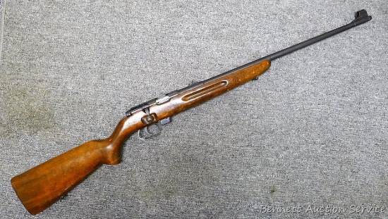 IMC2 bolt action .22 rifle. Rifle has a fixed rear blade sight and two flip up leaves. Barrel is
