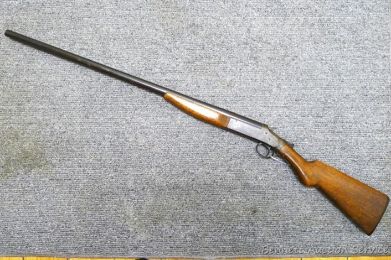 Scout top break shotgun. Action locks up tight. Butt stock is loose on rear tang, has an old crack