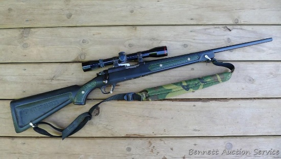 Ruger 77/22 bolt action rifle with 4x32 scope in easy-off mounts. 20" barrel with good bore and