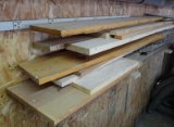 Finished and unfinished pieces of wood, longest is 100