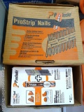 Partial boxes of Paslode ProStrip and RounDrive nails. Nails are about 2-1/8