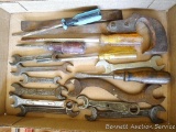 Open end wrenches SAE & metric, one has Ford USA on side; screw drivers; key hole saw; tire changing
