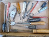 Screw drivers; thistle/dandelion digger; chalk line reel; wire cutter.