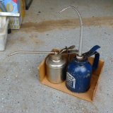 Two metal oil cans, largest is Eagle brand 12-1/2