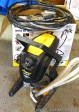 Wagner Control Pro airless sprayer model 150 with spray gun, hose and owner's manual. Unit is 15