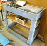 Rubbermaid 2 shelf tool cart on wheels has adjustable brackets for more shelving. Total size is