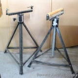 Two metal roller stands adjust from 26