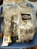 Tub of cabinet hinges and door handles of various styles and sizes.