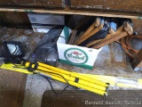 Halogen work light on a tripod stand; Panasonic radio/ CD player/ tape player; 5/8 wave antenna, and