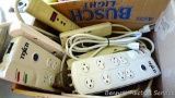 Two surge protectors and three power strips.