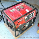 Honda EM2500 gasoline generator. 12V DC, 120V AC. Measures 20