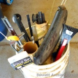 Five gallon bucket with ice fishing equipment including tip-ups, rods, braided nylon line, ice scoop