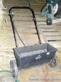 Yes! Yard Equipment System seed spreader, roller bar spins. Measures about 27