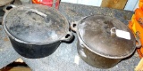 Two 4.5 quart cast iron Dutch ovens with lids, measure about 10