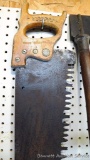 One-man saw is about 4' long and handle is marked Percy. Emblem on handle is marked Warranted
