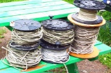 Six spools of electric fencing rope. Largest spool is 16