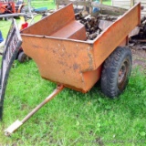 All steel firewood trailer with dump box is 4' x 4' x 2-1/2'. Big tires don't get stuck in the