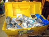Plano box filled with electrical supplies. Includes lamp holders, wire strippers, outlet boxes and