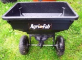 AgriFab pull behind seed spreader; bucket is about 22