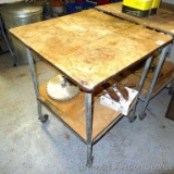 Handy rolling cart has an extra shelf below. Measures approx 24