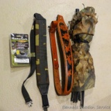 Advantage Timber camo blind section; leather and synthetic rifle slings; Masterlock brand gun lock.