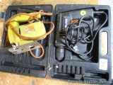 Black & Decker drill with box and a Black & Decker jig saw; both work. Cord of drill has been taped.
