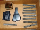AK-47 hunting magazine; SKS stripper clips and original fixed magazine; box of TCW and other 7.62x39